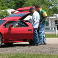 Sanjaya Vatuk and Dan Ziolkowski inspecting Rick Waller's car.