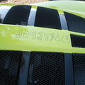 It kind of looks like Japanese writing at first, but these are race tracks this car has been on.